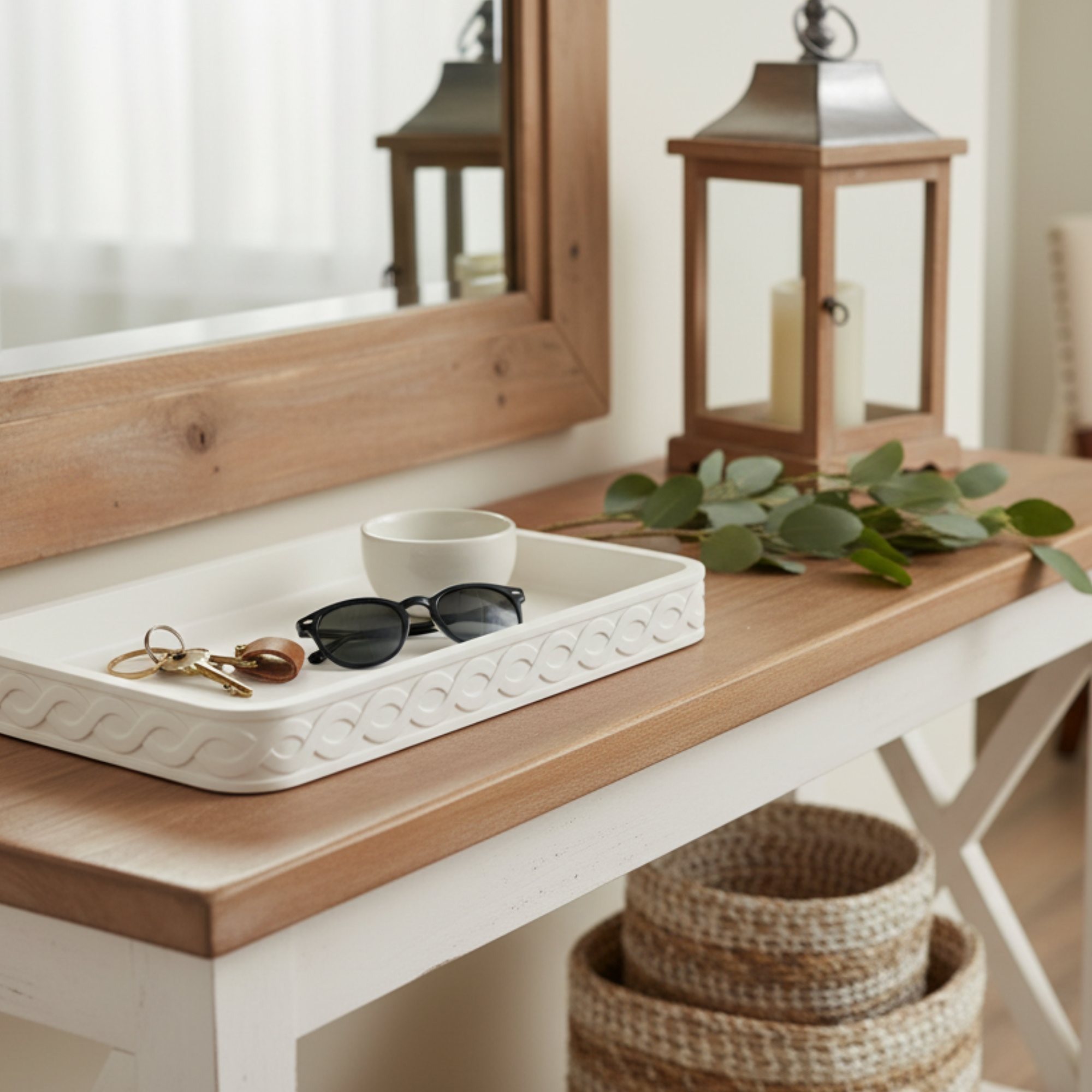 Decorative tray on an entry console with keys and sunglasses