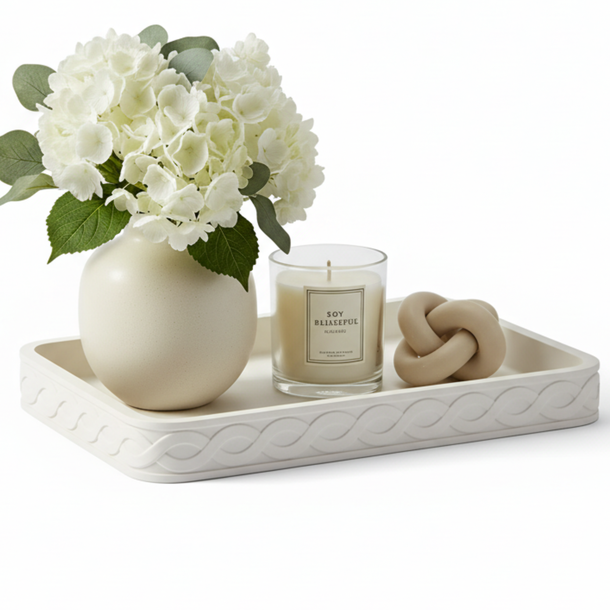 Decorative tray with flowers and a candle on a white background